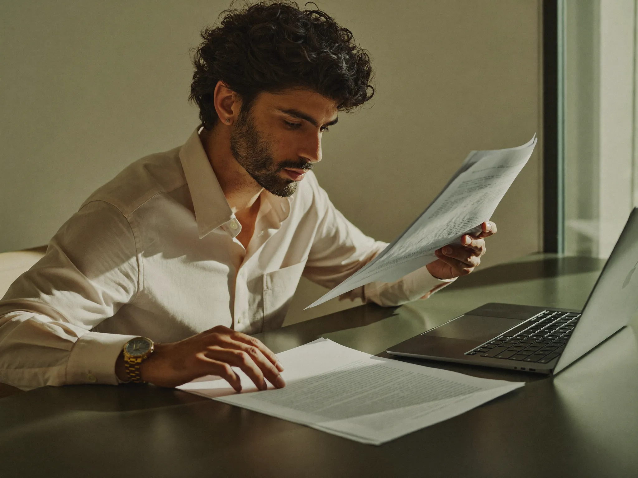 A professional reviewing job opportunities on a laptop